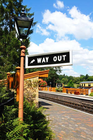 Arley, UK - July 10, 2014 - Way out sign attached to a wrought iron streetlight at the railway station, Severn Valley Railway, Arley, Worcestershire, England, UK, Western Europe.のeditorial素材