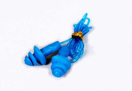 Swimming earplugs against a white background.の写真素材