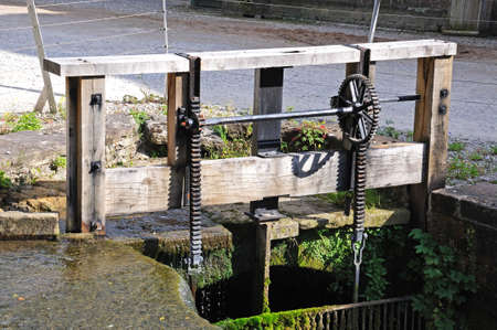 Cromford Mill (water powered cotton spinning mill) Sluice gate mechanism at Cromford Mill (water powered cotton spinning mill), Cromford, Derbyshire, England, UK, Western Europe.の写真素材