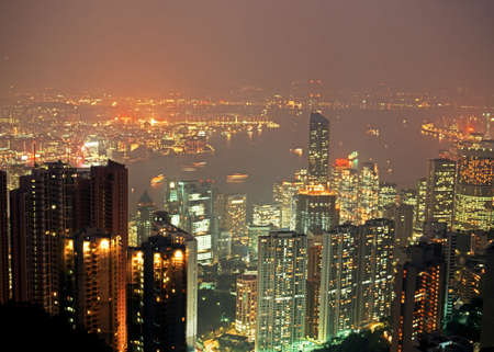 Central district and Victoria Harbour.  View looking down on the Skyscrapers of Hong Kong island at...