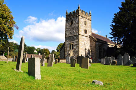 Ashford-in-the-Water, UK - September 7, 2014 - Holy Trinity Parish Church and churchyard, Ashford-in-the-Water, Derbyshire, England, UK, Western Europe.のeditorial素材