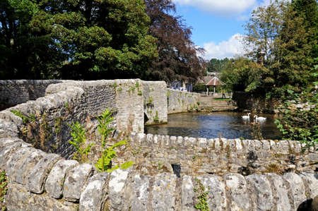Ashford-in-the-Water, UK - September 7, 2014 - Sheepwash bridge on the River Wye,...