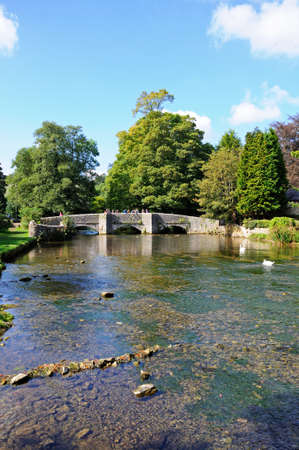 Ashford-in-the-Water, UK - September 7, 2014 - Sheepwash bridge on the River Wye, Ashford-in-the-Water, Derbyshire, England, UK, Western Europe.のeditorial素材