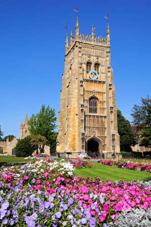Evesham, UK - September 8, 2014 - Abbey clock tower and flowerbeds in Abbey Gardens with St Lawrence church to the rear, Evesham, Worcestershire, England, UK, Western Europe.のeditorial素材