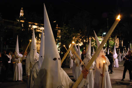 Seville, Spain - April 7, 2009 - Members of the Candelaria brotherhood at night during Santa Semama, Seville, Seville Province, Andalusia, Spain, Western Europe.のeditorial素材