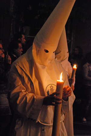 Seville, Spain - April 7, 2009 - Members of the Candelaria brotherhood at night during Santa Semama,...