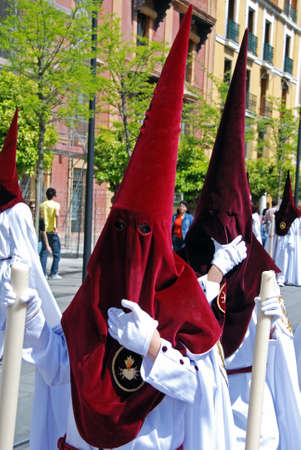 Seville, Spain - April 7, 2009 - Members of El Cerro brotherhood walking along the street during Santa Semama, Seville, Seville Province, Andalusia, Spain, Western Europe.のeditorial素材