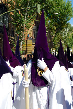 Seville, Spain - April 7, 2009 - Members of the San Benito brotherhood walking through the city streets during Santa Semama, Seville, Seville Province, Andalusia, Spain, Western Europe.のeditorial素材