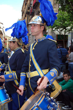 Seville, Spain - April 7, 2009 - Members of the San Esteban brotherhood band marching through the...