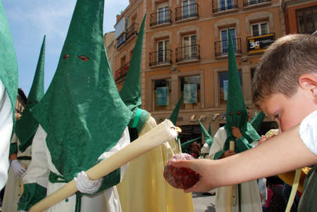 Malaga, Spain - April 5, 2009 - Members of the Pollinca brotherhoo walking through the city centre...