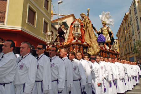 Malaga, Spain - April 5, 2009 - Members of the Salutation brotherhood walking through the city...