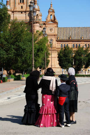 Seville, Spain - April 12, 2008 - Spanish family in traditional dress standing in the Plaza de Espana, Seville, Seville Province, Andalusia, Spain, Western Europe.のeditorial素材