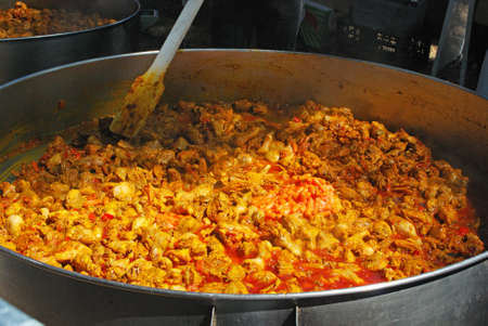 Large Paella being cooked during the Romeria San Bernabe procession, Marbella, Costa del Sol, Malaga Province, Andalusia, Spain, Western Europe.のeditorial素材