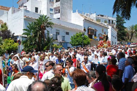 Statue of Saint Bernard on a float being carried through the town streets during the Romeria San Bernabe, Marbella, Costa del Sol, Malaga Province, Andalusia, Spain, Western Europe.のeditorial素材