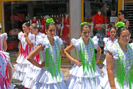 Teenage flamenco dancers in the street during the Romeria San Bernabe, Marbella, Costa del Sol, Malaga Province, Andalusia, Spain, Western Europe.のeditorial素材