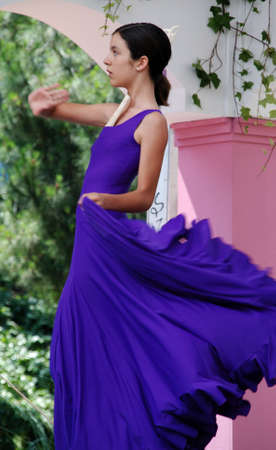 Young woman flamenco dancing during the Romeria San Bernabe, Marbella, Costa del Sol, Malaga Province, Andalusia, Spain, Western Europe.のeditorial素材