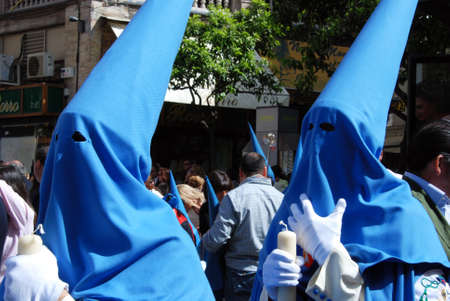Members of the San Esteban brotherhood walking through the city streets during Santa Semama,...