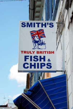 Fish and chip shop sign along Main Street, Gibraltar, United Kingdom, Western Europe.のeditorial素材