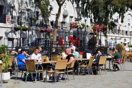 Tourists relaxing at a pavement cafe in Grand Casemates Square, Gibraltar, United Kingdom, Western Europe.のeditorial素材