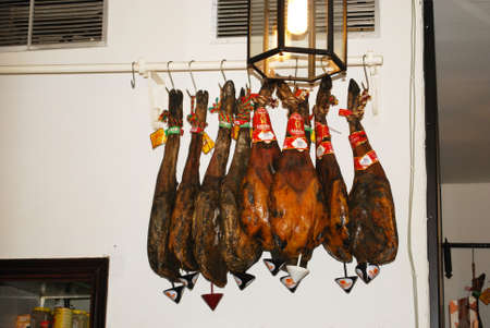 Legs of ham (Jamon Serrano) hanging in bar/restaurant, Sanlucar de Barrameda, Cadiz Province, Andalusia, Spain, Western Europe.のeditorial素材