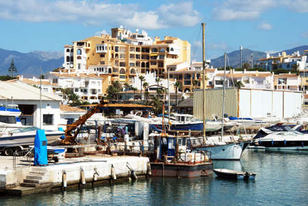 View of the harbour with apartment blocks to the rear, Puerto Cabopino, Marbella, Costa del Sol, Malaga Province, Andalucia, Spain.のeditorial素材