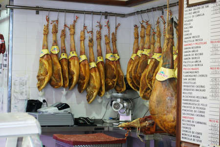 Legs of cured ham (Jamon Serrano) hanging in shop, Rute, Cordoba Province, Andalusia, Spain, Western Europe.のeditorial素材
