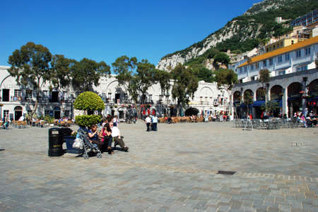 Tourists relaxing in Grand Casemates Square with pavement cafes to the rear, Gibraltar, United Kingdom, Western Europe.のeditorial素材