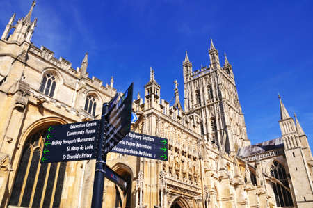 Cathedral church of St Peter and the Holy and Indivisible Trinity with a sign in the foreground, Gloucester, Gloucestershire, England, UK, Western Europe.のeditorial素材