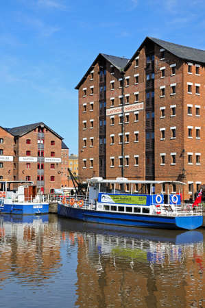 Pleasure boats moored in Gloucester Docks with warehouses to the rear, Gloucester, Gloucestershire, England, UK, Western Europe.のeditorial素材