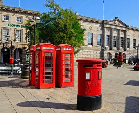 Red post box and telephone boxes with the Shire Hall Gallery to the rear in Market Square, Stafford, Staffordshire, England, UK, Western Europe.のeditorial素材