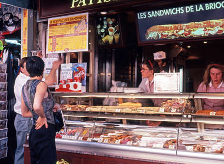 Customers looking at a sandwich bar in the city centre, Paris, France, Western Europe.のeditorial素材