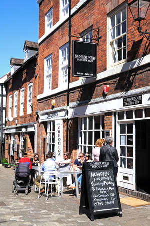 People relaxing at pavement cafes along Butcher Row during the Springtime, Shrewsbury, Shropshire, England, UK, Western Europe.のeditorial素材