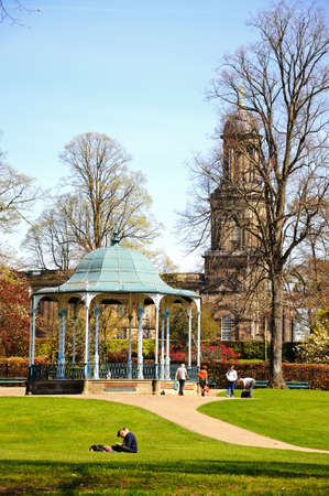 View of St Chads church with a bandstand in the foreground and people enjoying the sunshine, Shrewsbury, Shropshire, England, UK, Western Europe.のeditorial素材