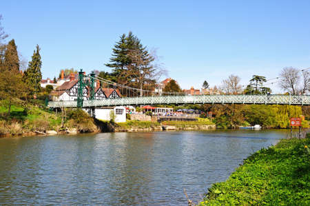 Porthill Suspension Bridge across the River Severn with the Boathouse Public House to the rear, Shrewsbury, Shropshire, England, UK, Western Europe.のeditorial素材