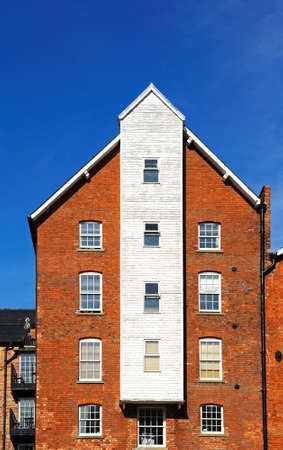 Old warehouses converted to housing in Gloucester Docks, Gloucester, Gloucestershire, England, UK, Western Europe.のeditorial素材