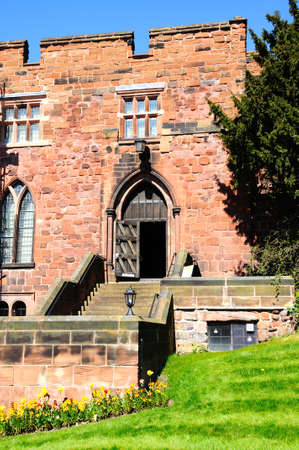 View of the sandstone castle entrance with Spring flowers in the foreground, Shrewsbury, Shropshire, England, UK, Western Europe.のeditorial素材