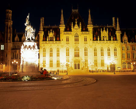 The Government palace in the Market Place lit up at night Bruges Belgium Western Europe.のeditorial素材