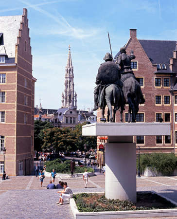 Spire of The Hotel De Ville in the Grand Place with a statue on Don Quixote and Sancho Panza in the foreground Belgium Western Europe.のeditorial素材