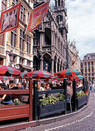 Tourists relaxing at a pavement cafe outside the Maison du Roi Kings House in the Grand Place Brussels Belgium Western Europe.のeditorial素材