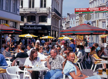 Tourists relaxing at pavement cafes on the Rue de Marche Brussels Belgium Western Europe.のeditorial素材