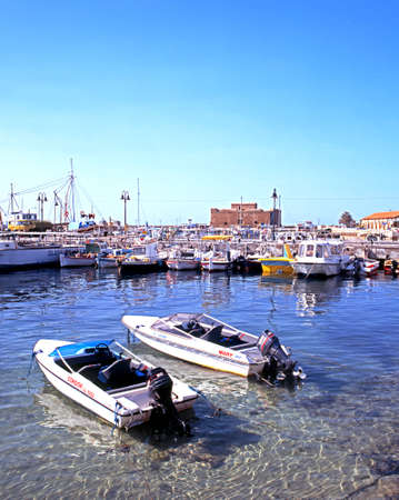 Power boats and fishing boats in harbour with castle to rear Paphos Cyprus.のeditorial素材