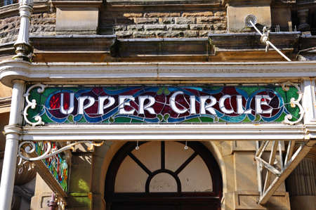 Stained glass Upper Circle sign in a wrought iron frame on the front of the Opera House, Buxton, Derbyshire, England, UK, Western Europe.のeditorial素材