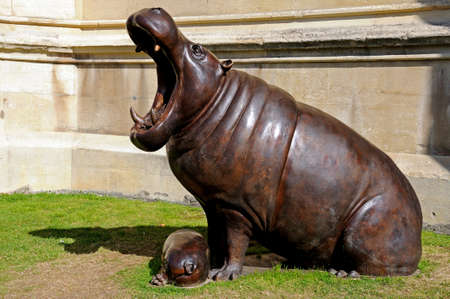 Hippopotamus with calf statue outside the Cathedral Gloucester Gloucestershire England UK Western Europe.の写真素材