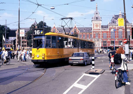 Tram outside the central railway station (Centraal), Amsterdam, Holland, Netherlands, Europe.のeditorial素材