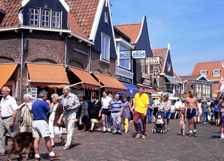 Tourists walking along a shopping street during the Summertime, Volendam, Holland, Netherlands, Europe.のeditorial素材