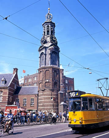 City centre tram with the Munttoren clock tower to the rear at Muntplein, Amsterdam, Holland, Netherlands, Europe.のeditorial素材