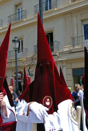 Members of El Cerro brotherhood walking through the city streets during Santa Semama, Seville, Seville Province, Andalusia, Spain, Western Europe.のeditorial素材