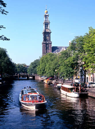 Boats on the Prinsengracht with the Westerkerk to rear, Amsterdam, Holland, Netherlands, Europe.のeditorial素材
