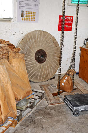 Sack hoist chain and sacks of flour inside Greens windmill, Nottingham, Nottinghamshire, England,...
