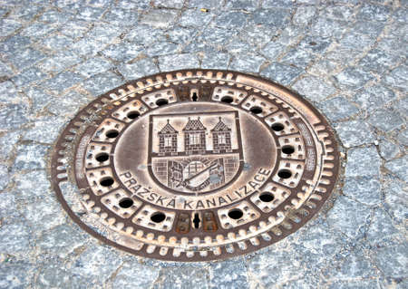Prazska Kanalizace Manhole cover in the road, Prague, Czech Republic, Eastern Europe.のeditorial素材